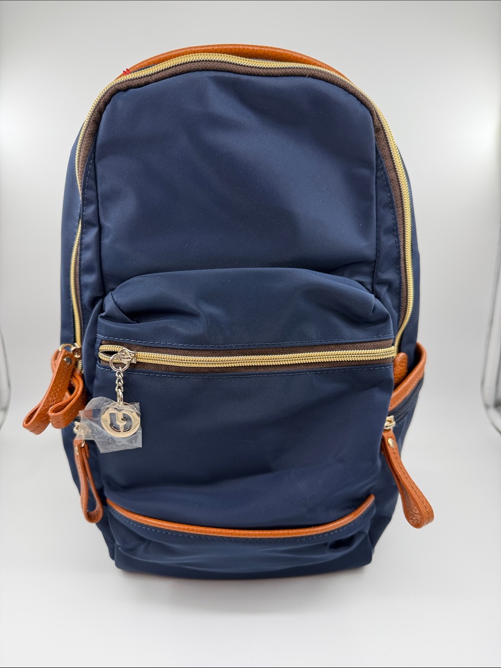 Charles Jourdan Navy Backpack with Tan Accents and Gold Hardware